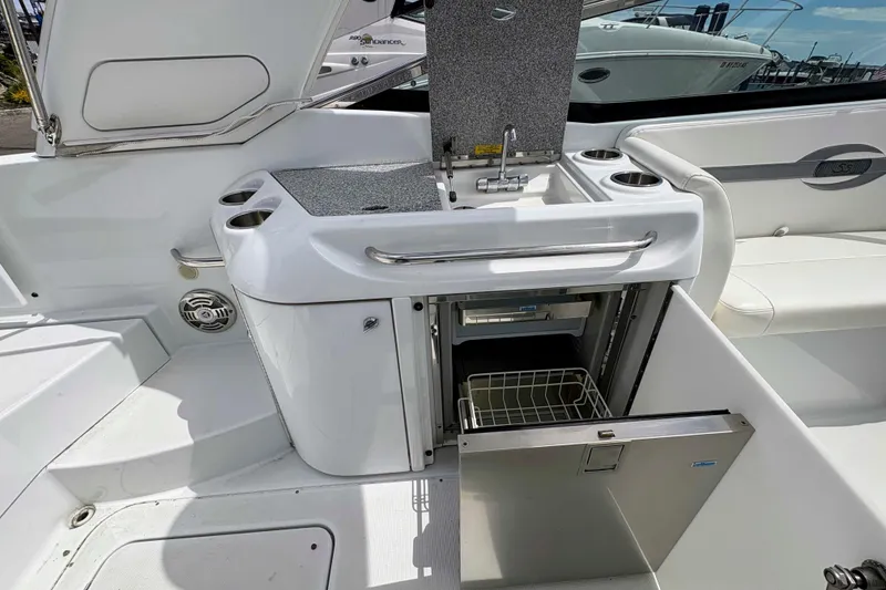 Slide: The Image of 2008 Formula 310 Sun Sport boat interior with kitchenette and storage. - 11