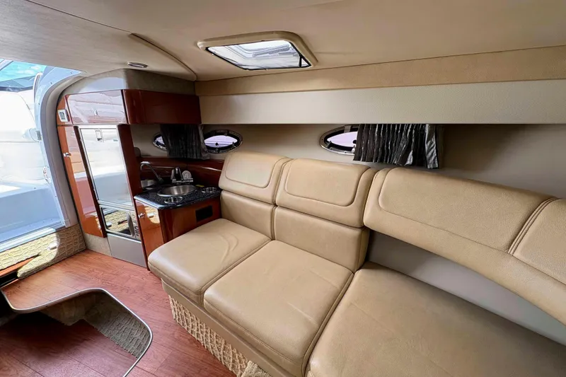 Slide: The Image of Interior of 2008 Formula 310 Sun Sport boat with beige seating and kitchenette. - 15