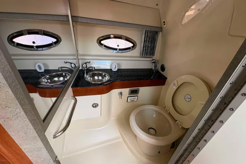 Slide: The Image of Luxurious 2008 Formula 310 Sun Sport boat bathroom with sink and toilet. - 17