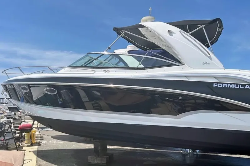 Slide: The Image of 2008 Formula 310 Sun Sport boat docked, featuring "Happy H'ours" name on the stern. - 3