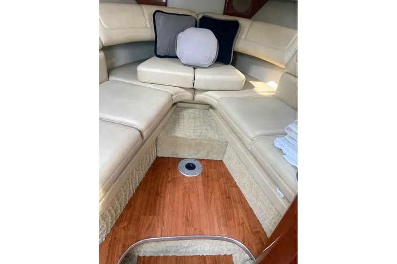 Slide: The Image of 2008 Formula 310 Sun Sport boat on lift, black and white exterior, cloudy sky background. - 6