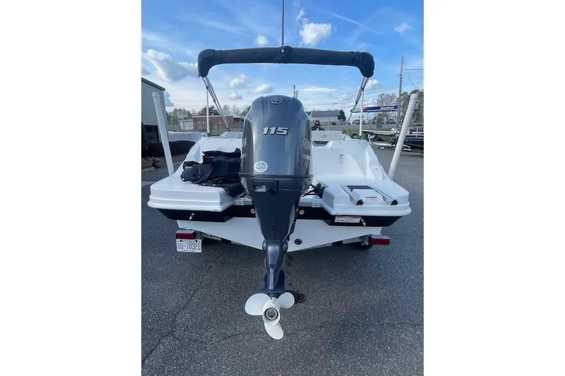 Slide: The Image of 2023 Hurricane SunDeck Sport 185 OB boat with 115 HP outboard motor, rear view. - 4