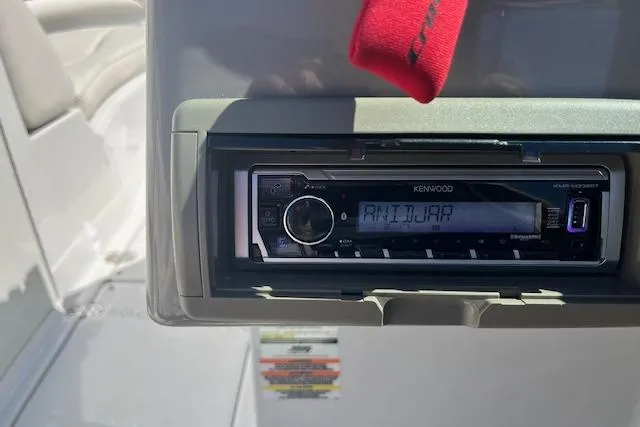 Slide: The Image of Kenwood stereo system in a 2005 Crownline 240 EX boat dashboard. - 11