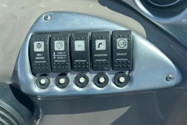 Slide: The Image of Control panel of a 2005 Crownline 240 EX boat with labeled switches. - 13