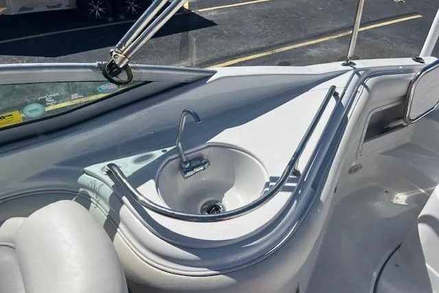 Slide: The Image of 2005 Crownline 240 EX boat interior with sink and faucet detail. - 16