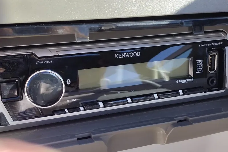 Slide: The Image of Kenwood stereo system in a 2005 Crownline 240 EX boat dashboard. - 26