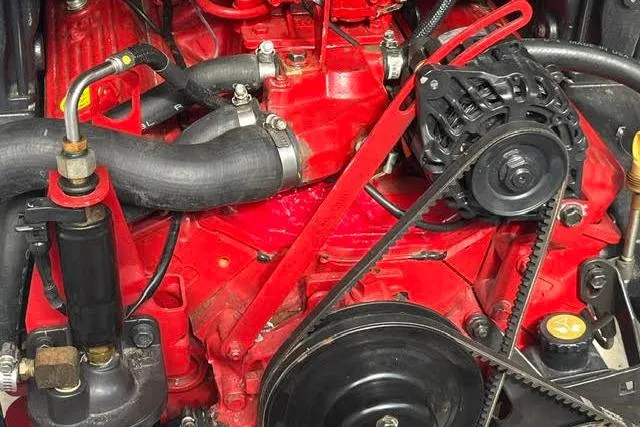 Slide: The Image of 2005 Crownline 240 EX engine close-up, showcasing red components and belts. - 41