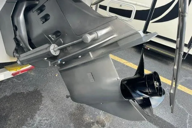 Slide: The Image of Outboard motor of a 2005 Crownline 240 EX boat on a trailer. - 43
