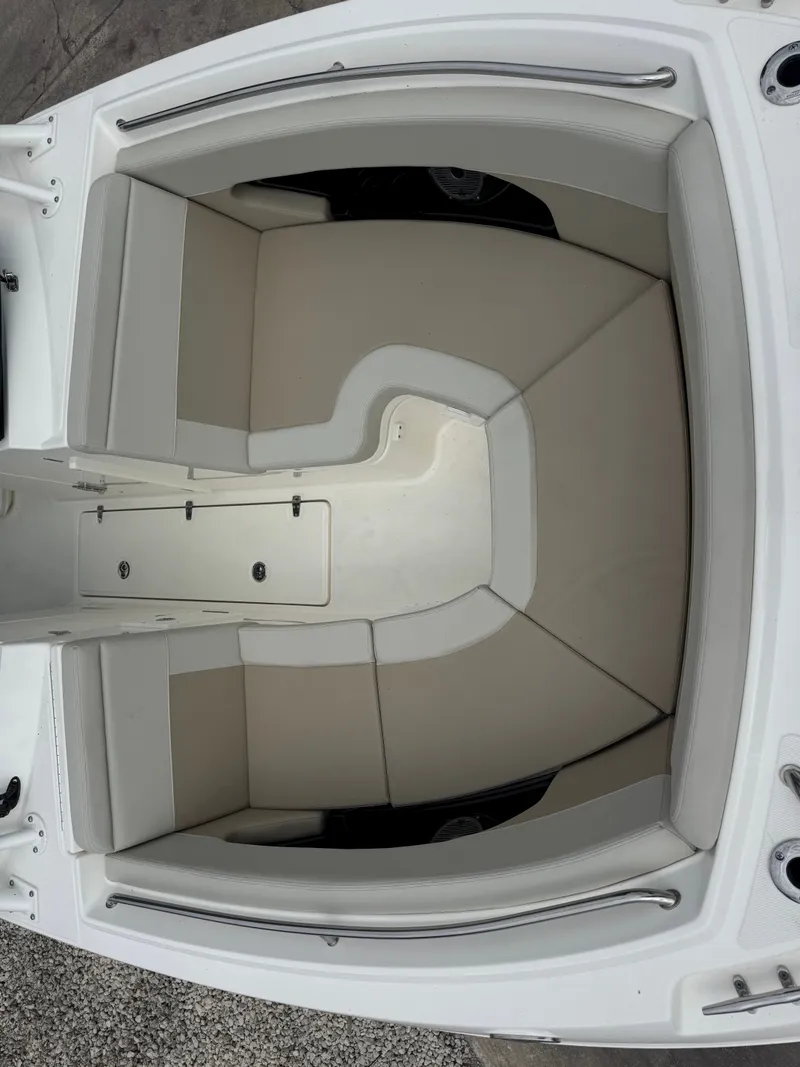 Slide: The Image of The 2027 Boston Whaler 240 Vantage features a spacious, cushioned seating area in the bow. - 19