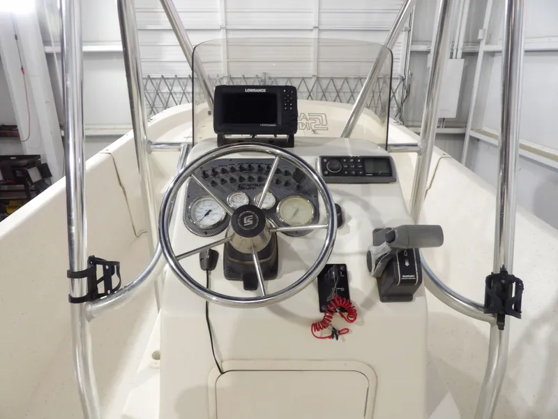 Slide: The Image of 2013 Carolina Skiff 238 DLV with Suzuki outboard motor. - 12