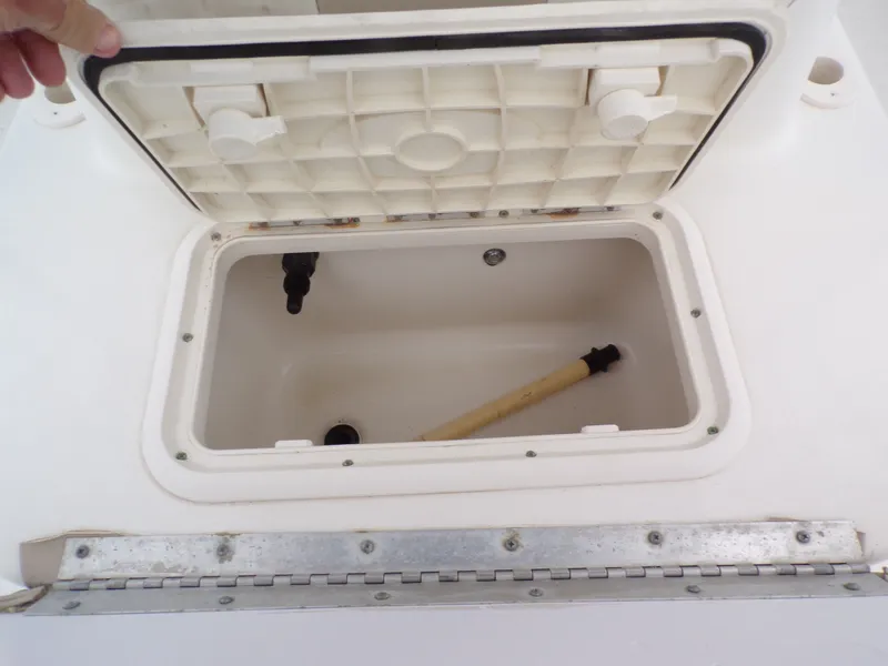 Slide: The Image of Open storage compartment on a 2013 Carolina Skiff 238 DLV boat. - 20