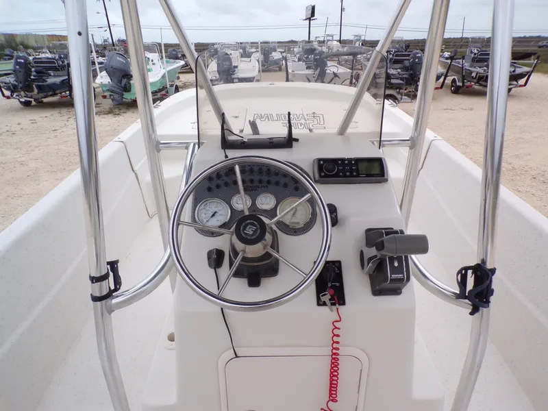 Slide: The Image of Steering console of a 2013 Carolina Skiff 238 DLV boat. - 24