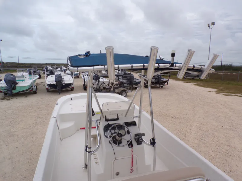 Slide: The Image of 2013 Carolina Skiff 238 DLV boat in a parking lot. - 25