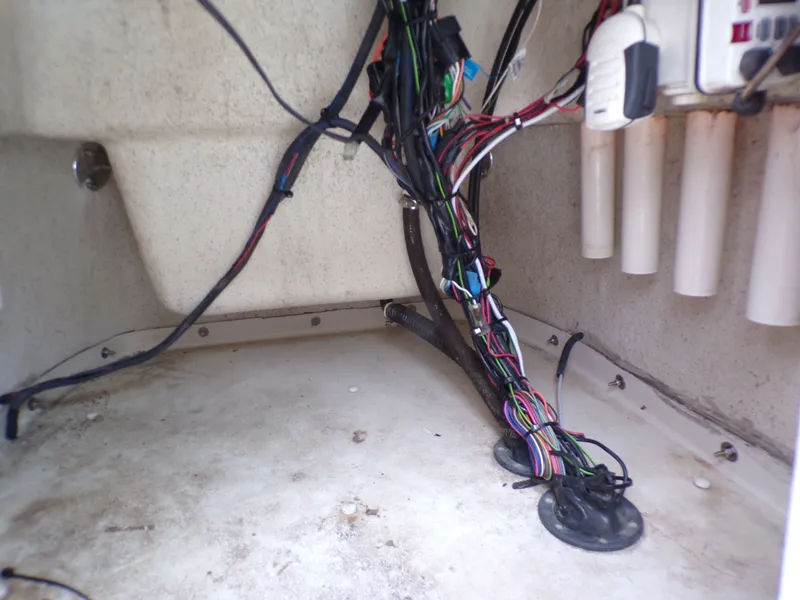 Slide: The Image of Interior of a 2013 Carolina Skiff 238 DLV boat, wiring visible. - 26