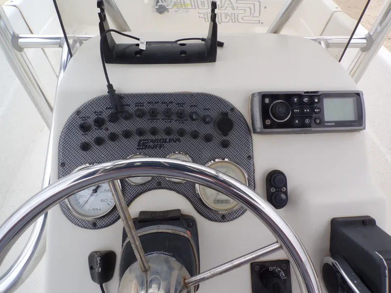 Slide: The Image of Steering console of a 2013 Carolina Skiff 238 DLV boat. - 27