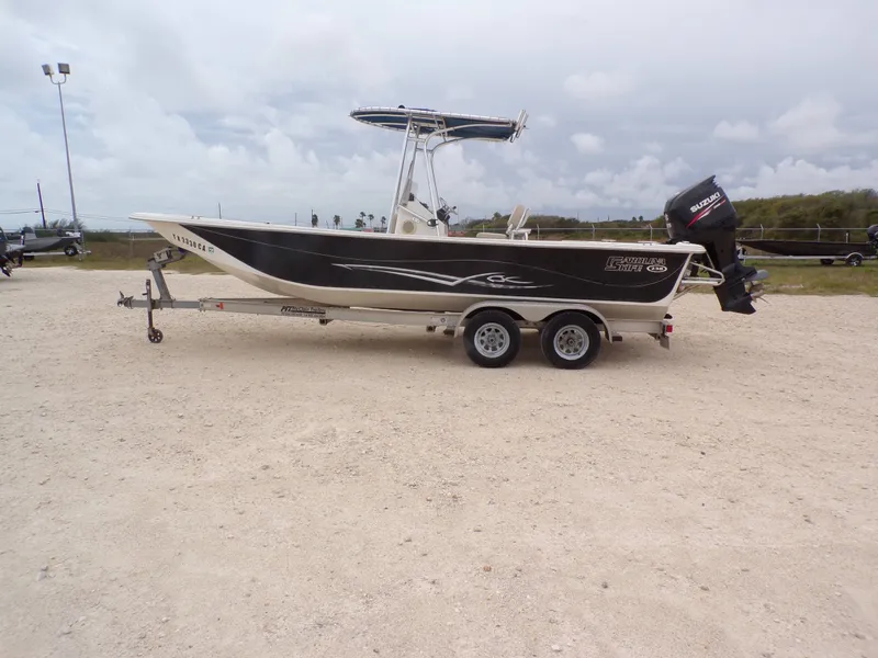 Slide: The Image of 2013 Carolina Skiff 238 DLV boat on trailer, Suzuki outboard motor. - 29