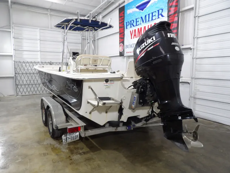 Slide: The Image of 2013 Carolina Skiff 238 DLV on trailer, cloudy sky. - 6