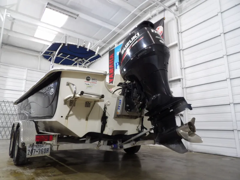 Slide: The Image of 2013 Carolina Skiff 238 DLV on trailer, Suzuki engine. - 7