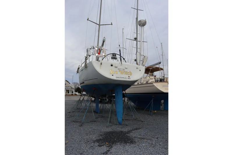 Slide: The Image of Beneteau First 47.7 sailboat, 2005 model, on stands in a boatyard. - 1