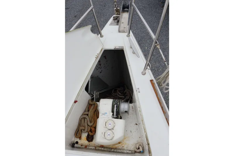 Slide: The Image of Open anchor locker on 2005 Beneteau First 47.7 sailboat, showing ropes and equipment. - 18