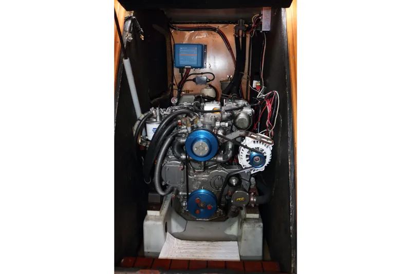 Slide: The Image of Engine compartment of a 2005 Beneteau First 47.7 sailboat, showcasing mechanical components. - 19