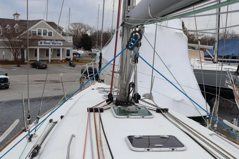 Slide: The Image of Beneteau First 47.7 sailboat docked near West Marine store, 2005 model. - 4