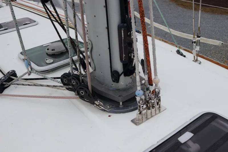 Slide: The Image of Deck rigging of a 2005 Beneteau First 47.7 sailboat, featuring ropes and pulleys. - 6