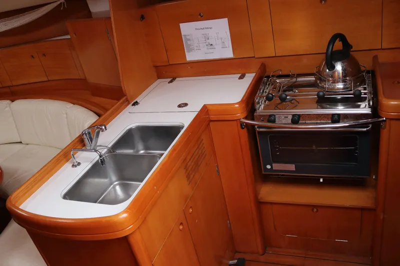 Slide: The Image of Interior of 2005 Beneteau First 47.7 yacht kitchen with sink and stove. - 7