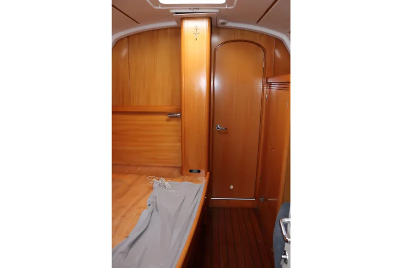Slide: The Image of Interior cabin of 2005 Beneteau First 47.7 yacht with wooden finish and door. - 9