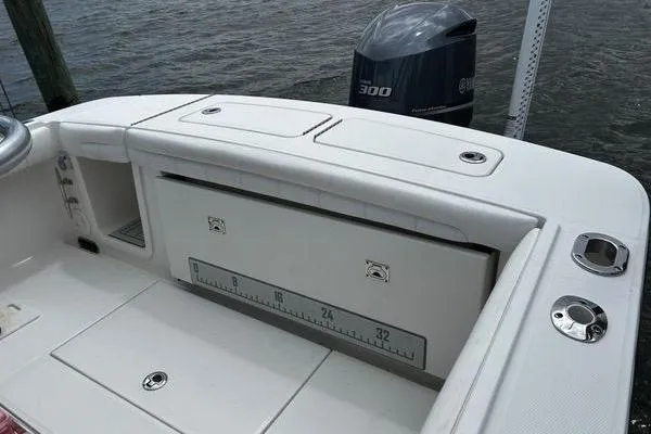 Slide: The Image of 2018 Regulator 23 Forward Seating boat with Yamaha 300 engine, featuring spacious deck and storage. - 10