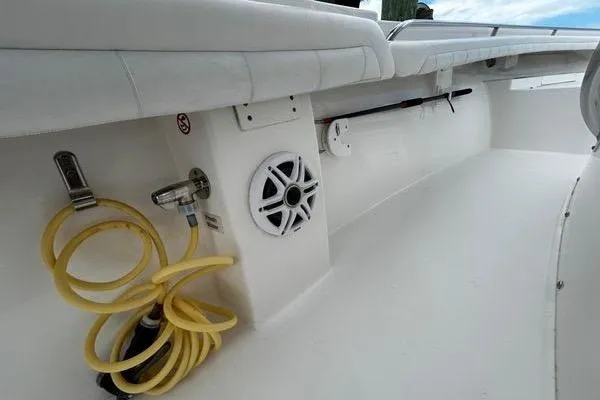 Slide: The Image of 2018 Regulator 23 Forward Seating boat interior with speaker and hose. - 34