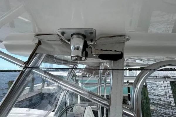 Slide: The Image of 2018 Regulator 23 Forward Seating boat with stainless steel frame and clear canopy. - 35