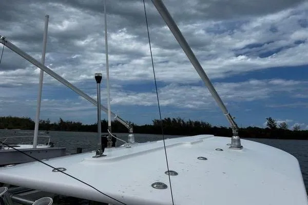 Slide: The Image of 2018 Regulator 23 Forward Seating boat under cloudy sky on water. - 38
