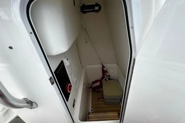 Slide: The Image of 2018 Regulator 23 Forward Seating boat interior storage compartment. - 49