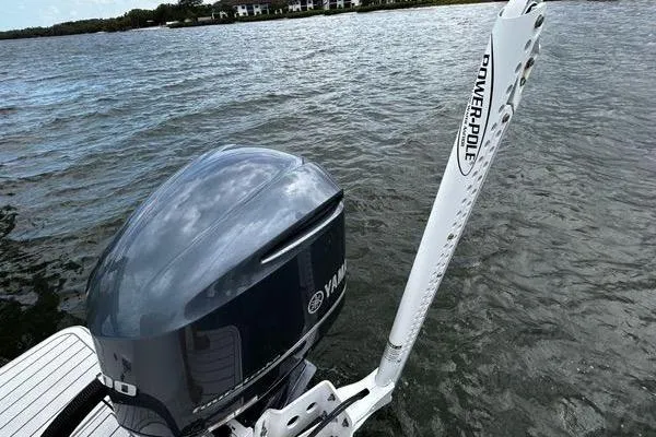 Slide: The Image of 2018 Regulator 23 Forward Seating boat with Yamaha engine and Power-Pole on water. - 5
