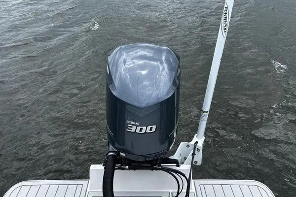 Slide: The Image of 2018 Regulator 23 Forward Seating boat with Yamaha 300 outboard motor on water. - 6