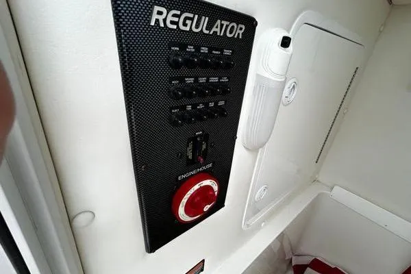Slide: The Image of Control panel of 2018 Regulator 23 Forward Seating boat with switches and engine house dial. - 60
