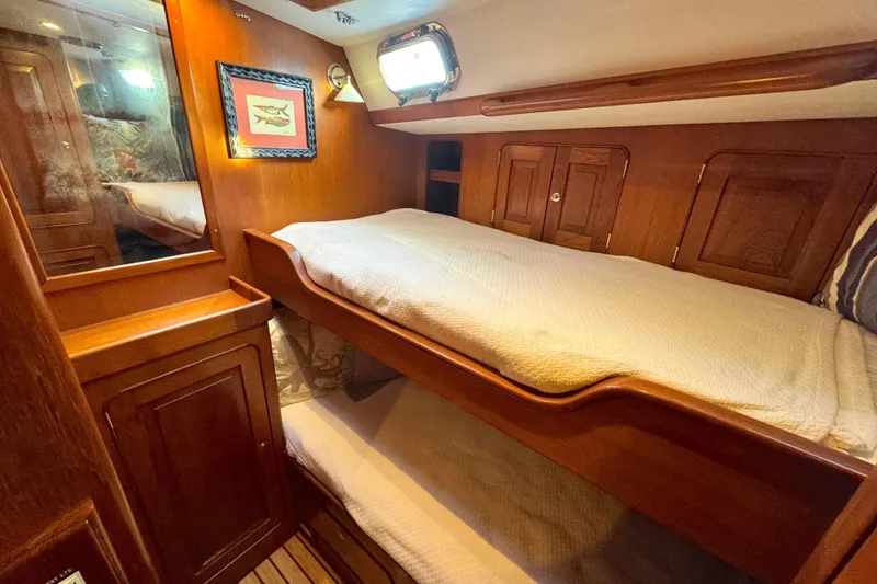 Slide: The Image of Cozy cabin interior of 2009 Hylas 54 yacht with wooden bunk beds. - 14