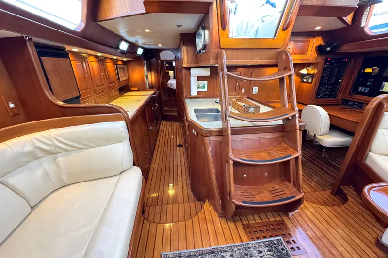 Slide: The Image of Luxurious 2009 Hylas 54 yacht interior with wooden finishes and comfortable seating. - 15