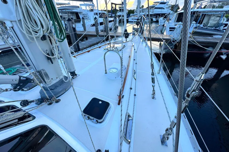Slide: The Image of Deck view of a 2009 Hylas 54 yacht docked at a marina. - 6