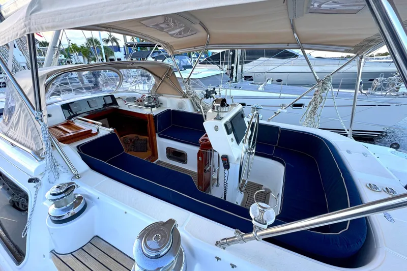 Slide: The Image of 2009 Hylas 54 yacht cockpit with blue seating, steering wheel, and navigation equipment. - 9