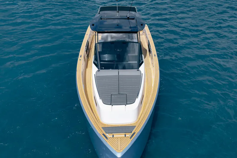 Slide: The Image of 2024 Pardo Yachts 43 cruising on clear blue water, showcasing sleek design and luxury. - 13