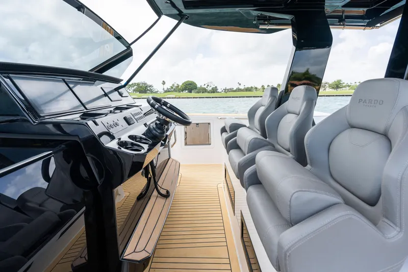 Slide: The Image of Luxurious 2024 Pardo Yachts 43 interior with sleek helm and plush seating. - 18