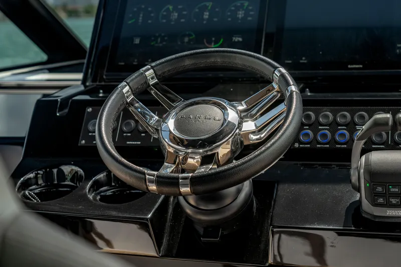 Slide: The Image of Steering wheel of 2024 Pardo Yachts 43, featuring modern dashboard controls. - 22