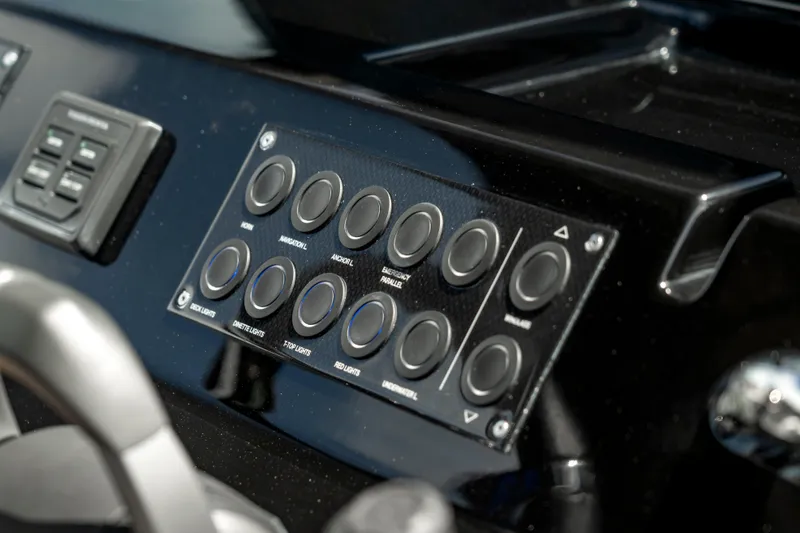 Slide: The Image of Control panel of 2024 Pardo Yachts 43, featuring multiple buttons and switches. - 23