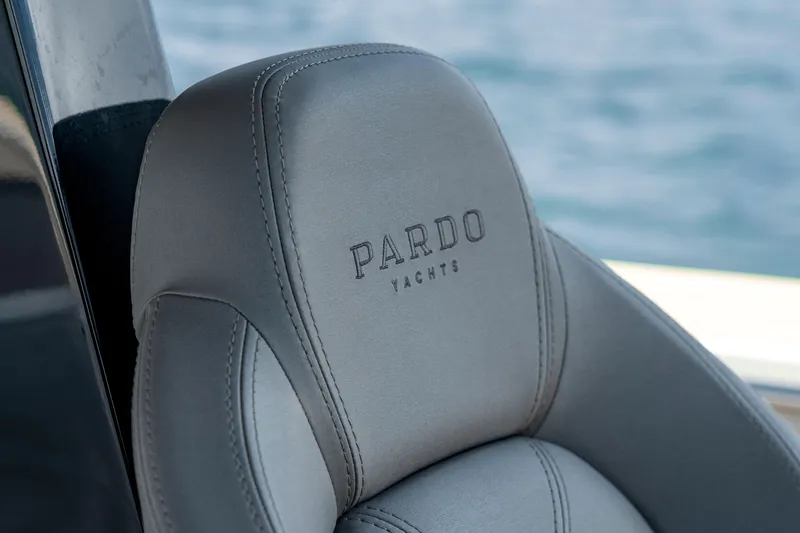 Slide: The Image of Close-up of 2024 Pardo Yachts 43 seat with logo, against a blurred ocean background. - 29