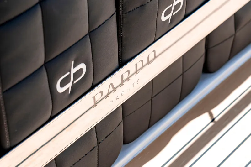 Slide: The Image of Close-up of 2024 Pardo Yachts 43 branding on luxurious black seating. - 31