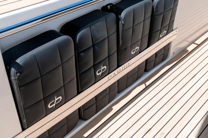 Slide: The Image of Luxury seating on 2024 Pardo Yachts 43, featuring sleek black cushions and teak decking. - 32