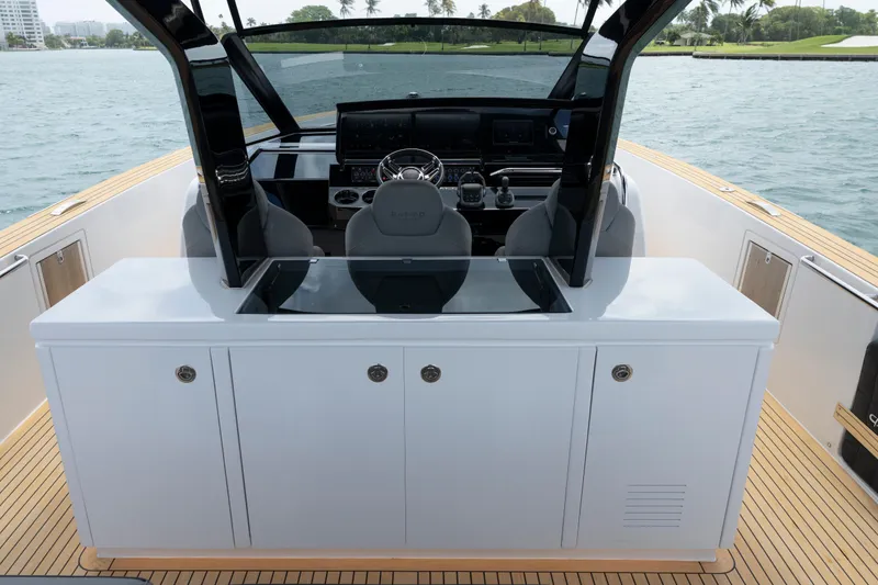 Slide: The Image of 2024 Pardo Yachts 43 helm with modern controls and sleek design on open water. - 33