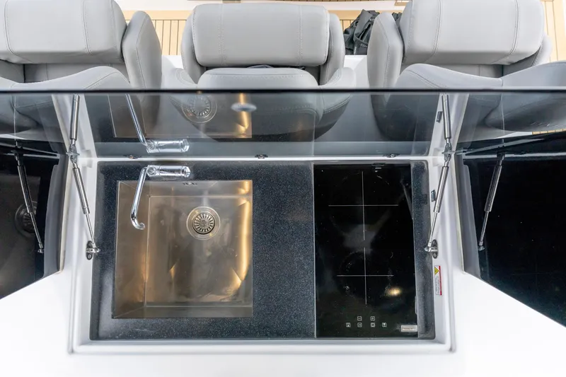 Slide: The Image of Modern kitchen area on 2024 Pardo Yachts 43, featuring sleek sink and induction cooktop. - 35